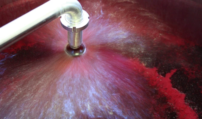 Winery worker completing a pump over